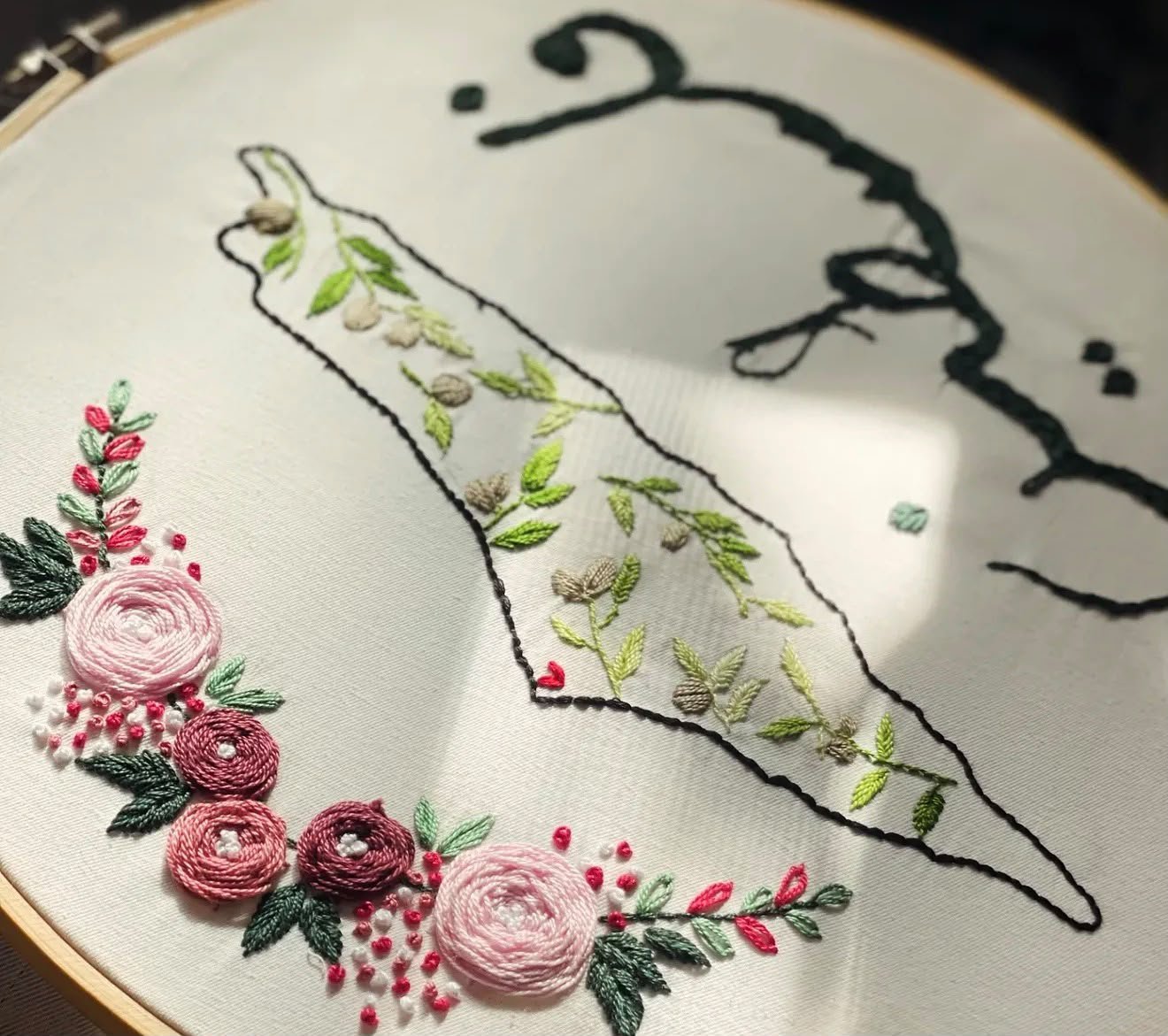 Close detail of raised floral embroidery